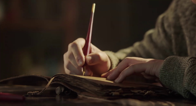 wu xie hand closeup with desk pen